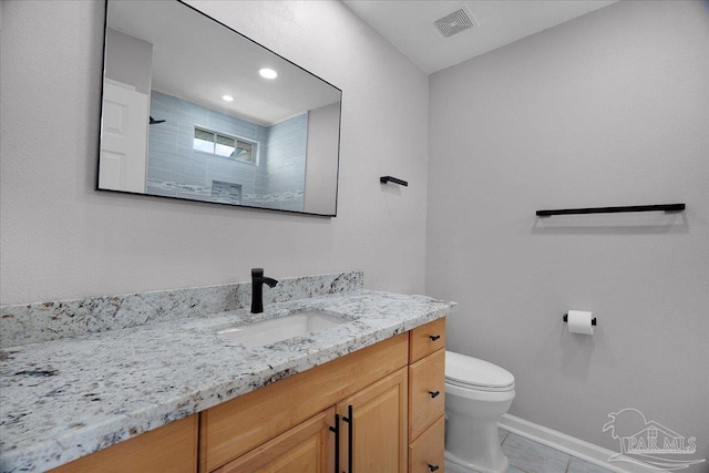 601 E Burgess Rd Unit J2, Pensacola, FL 32504 - full bath with vanity, toilet, baseboards, and tile patterned flooring