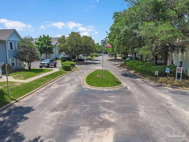 601 E Burgess Rd Unit J2, Pensacola, FL 32504 - view of asphalt street featuring curbs, traffic signs, and a residential view
