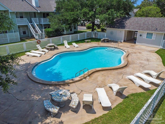 601 E Burgess Rd Unit J2, Pensacola, FL 32504 - community pool with a fenced backyard and a patio