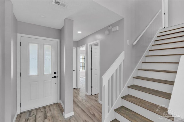 601 E Burgess Rd Unit J2, Pensacola, FL 32504 - foyer featuring light wood finished floors, baseboards, stairway, and recessed lighting