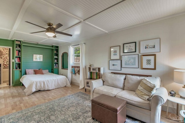 bedroom with wood finished floors and a ceiling fan