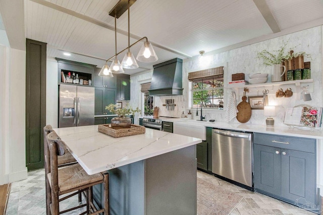 kitchen with wall chimney range hood, light stone countertops, beam ceiling, appliances with stainless steel finishes, and open shelves