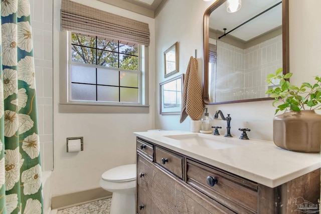 bathroom featuring baseboards, toilet, vanity, and a shower with curtain