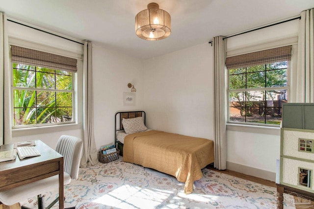 bedroom featuring wood finished floors