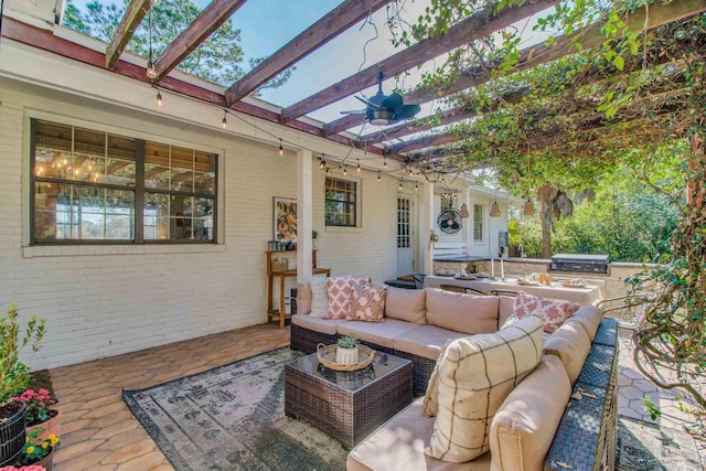 view of patio / terrace with outdoor lounge area, an outdoor kitchen, a pergola, and a grill