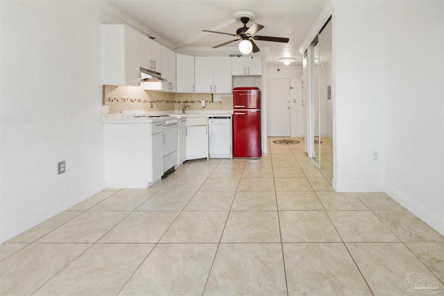 kitchen with decorative backsplash, light tile patterned floors, white appliances, and ceiling fan