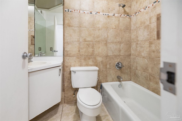 full bathroom featuring tile patterned floors, vanity, tile walls, toilet, and tiled shower / bath