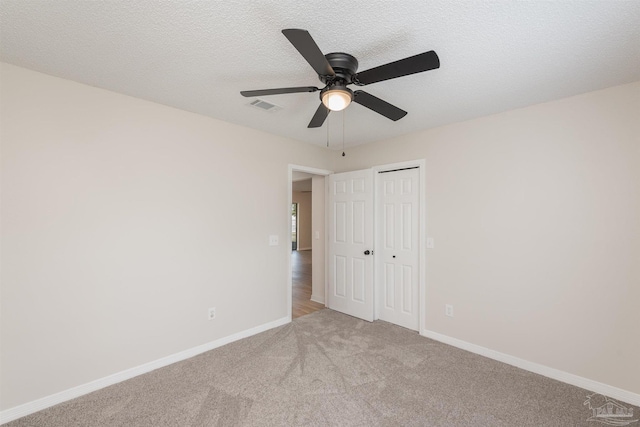 10104 Clearsound Dr, Pensacola, FL 32506 - unfurnished bedroom with baseboards, visible vents, light colored carpet, a ceiling fan, and a closet