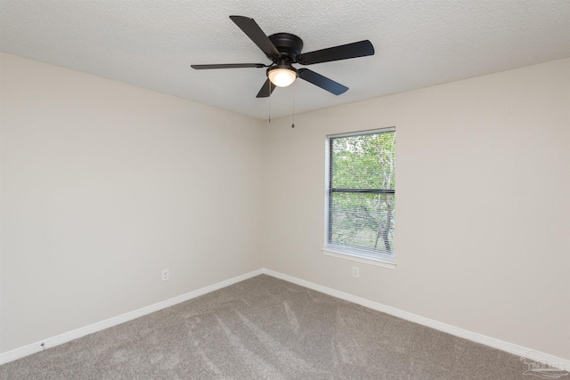 10104 Clearsound Dr, Pensacola, FL 32506 - carpeted empty room with baseboards, a textured ceiling, and ceiling fan