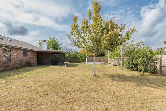 10104 Clearsound Dr, Pensacola, FL 32506 - view of yard with a fenced backyard and a sunroom