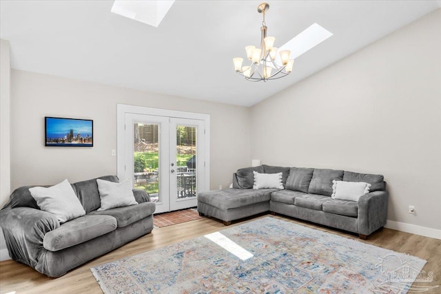 4308 Northpointe Way, Pensacola, FL 32514 - living room with a skylight, a chandelier, wood finished floors, and lofted ceiling
