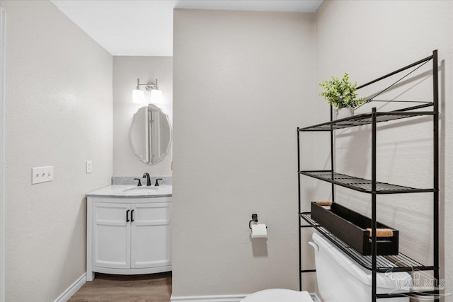 4308 Northpointe Way, Pensacola, FL 32514 - half bathroom with toilet, wood finished floors, vanity, and baseboards