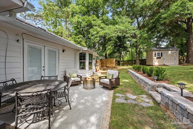 4308 Northpointe Way, Pensacola, FL 32514 - view of patio / terrace with a storage unit, an outdoor structure, outdoor dining area, and an outdoor living space with a fire pit