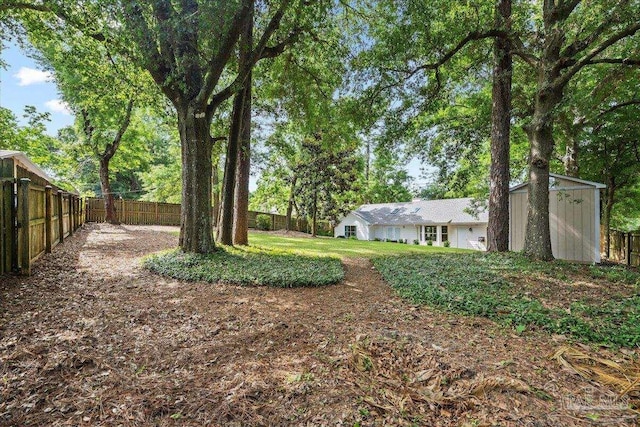 4308 Northpointe Way, Pensacola, FL 32514 - fenced backyard with a storage shed and an outdoor structure