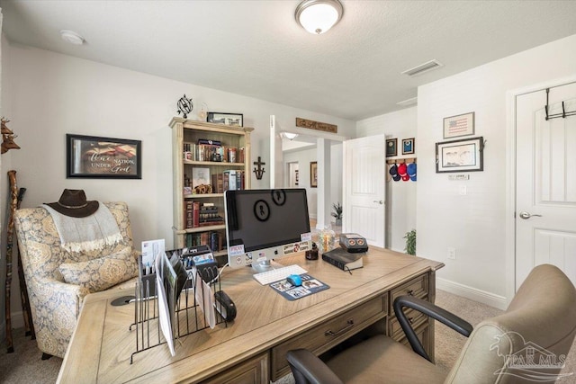 carpeted office with baseboards