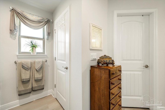 hallway featuring light wood finished floors