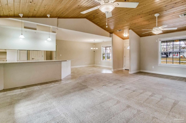 unfurnished living room featuring wood ceiling, light colored carpet, lofted ceiling, and ceiling fan with notable chandelier