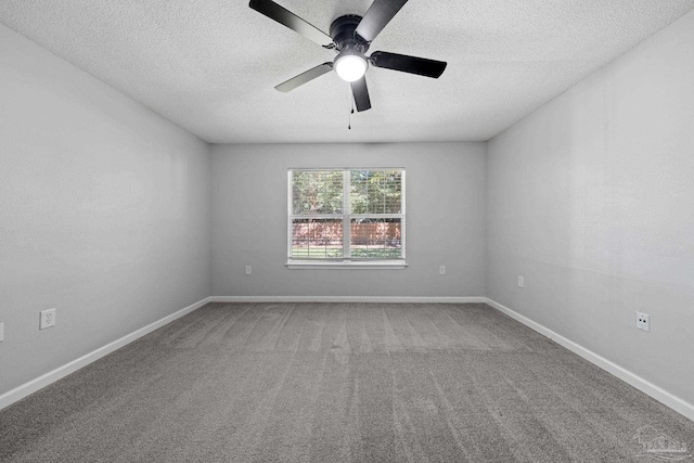 carpeted spare room with a textured ceiling and ceiling fan