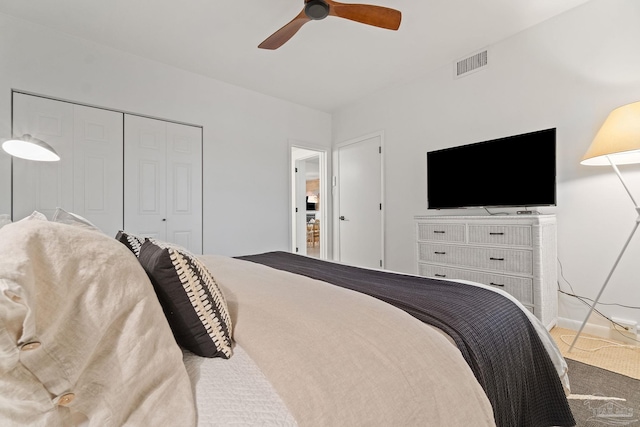 bedroom featuring a closet, visible vents, ceiling fan, and baseboards