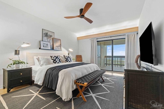 bedroom with access to outside and a ceiling fan