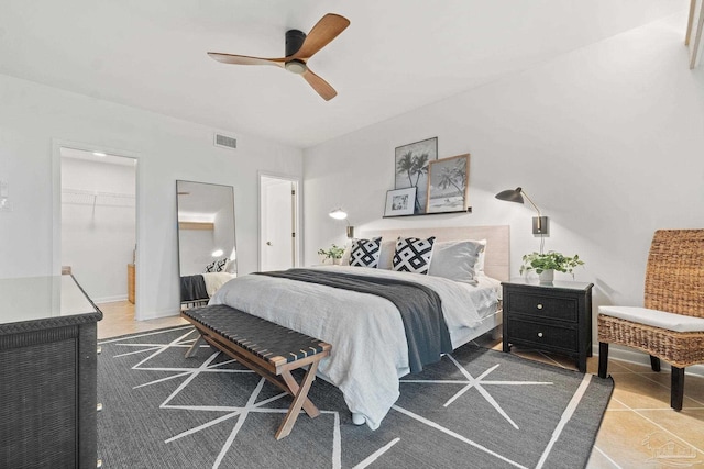 tiled bedroom featuring ceiling fan and visible vents