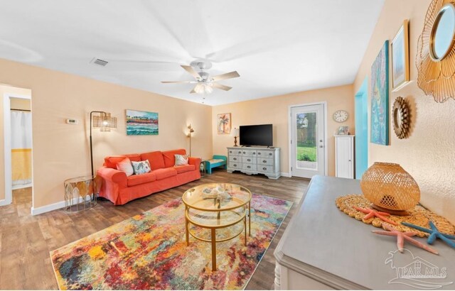 7837 Skyview Blvd, Navarre, FL 32566 - living area with wood finished floors and a ceiling fan