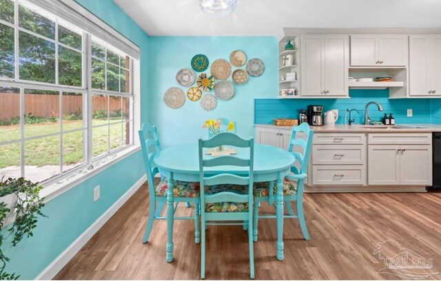 7837 Skyview Blvd, Navarre, FL 32566 - dining room with light wood finished floors and baseboards