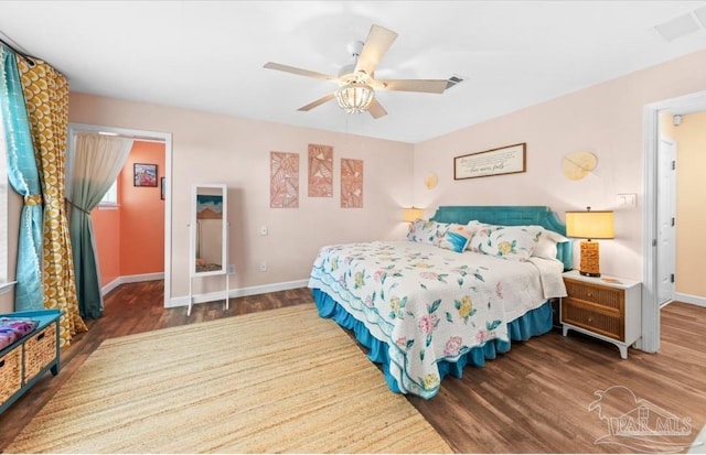 7837 Skyview Blvd, Navarre, FL 32566 - bedroom with wood finished floors and a ceiling fan