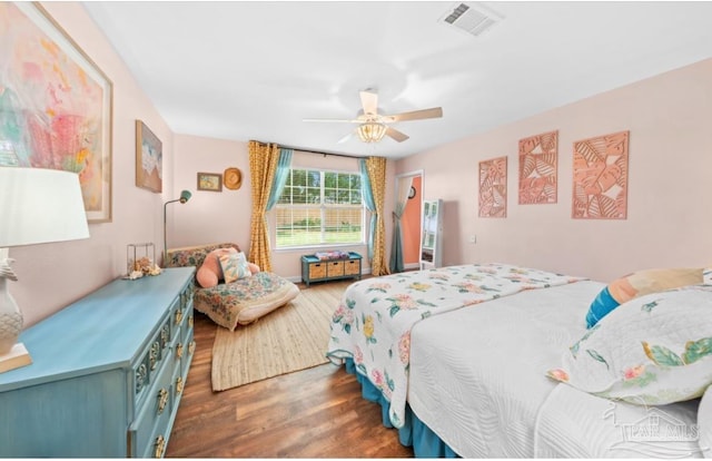 7837 Skyview Blvd, Navarre, FL 32566 - bedroom featuring wood finished floors and a ceiling fan