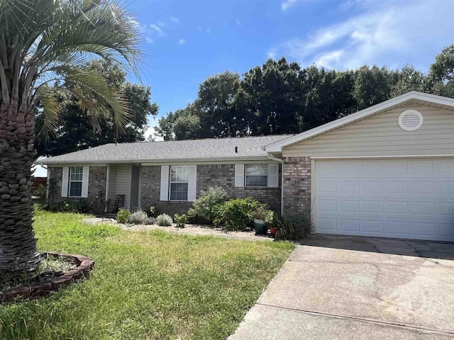 7837 Skyview Blvd, Navarre, FL 32566 - single story home featuring a front yard, driveway, brick siding, and a garage