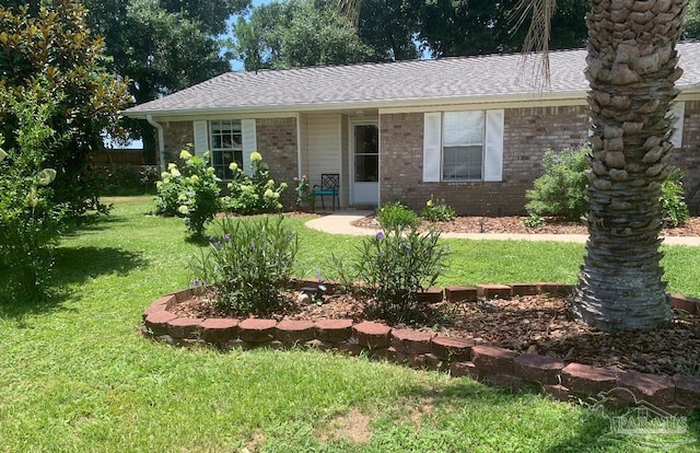 7837 Skyview Blvd, Navarre, FL 32566 - ranch-style home featuring a front lawn, brick siding, and a shingled roof