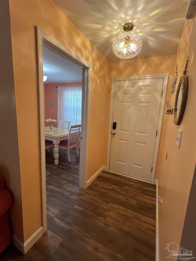 7837 Skyview Blvd, Navarre, FL 32566 - hall featuring dark wood-style flooring and baseboards