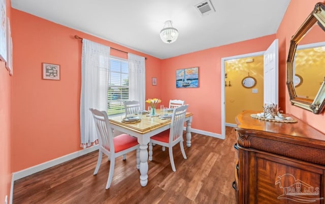 7837 Skyview Blvd, Navarre, FL 32566 - dining space with baseboards and wood finished floors