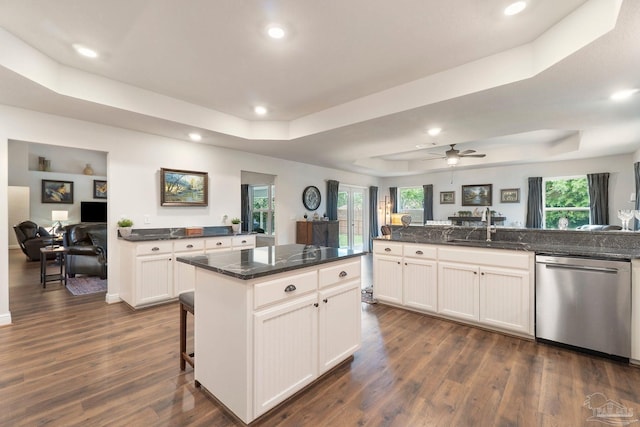 2849 Pga Blvd, Navarre, FL 32566 - kitchen with dishwasher, a raised ceiling, a sink, dark wood-style flooring, and recessed lighting