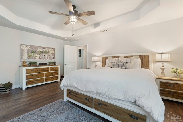 2849 Pga Blvd, Navarre, FL 32566 - bedroom with a raised ceiling, wood finished floors, ceiling fan, and baseboards