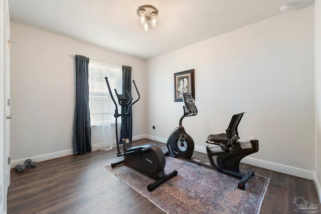 2849 Pga Blvd, Navarre, FL 32566 - exercise area with wood finished floors and baseboards