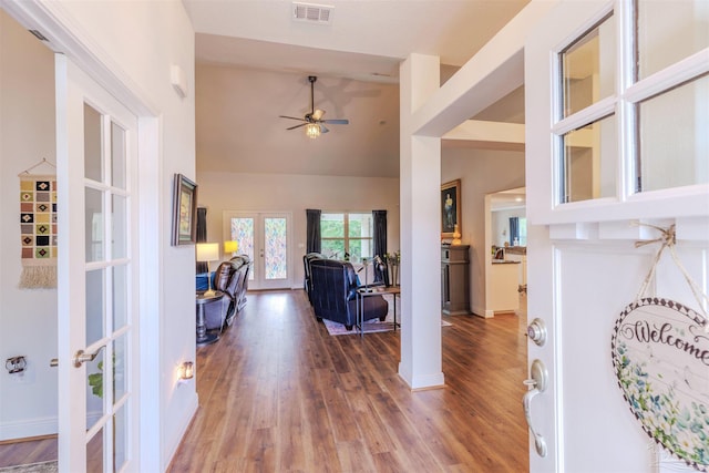 2849 Pga Blvd, Navarre, FL 32566 - entrance foyer featuring french doors, a ceiling fan, light wood finished floors, baseboards, and high vaulted ceiling