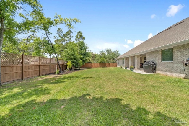 2849 Pga Blvd, Navarre, FL 32566 - view of yard with a patio