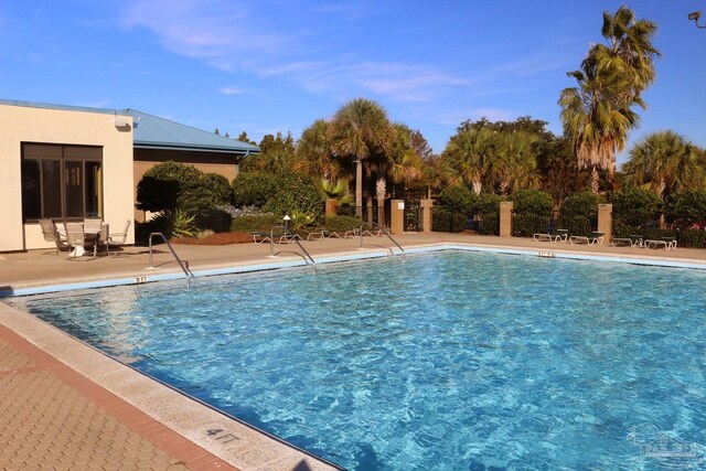 2849 Pga Blvd, Navarre, FL 32566 - community pool featuring a patio