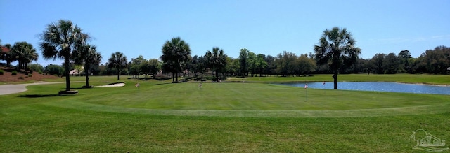 2849 Pga Blvd, Navarre, FL 32566 - view of home's community with golf course view, a water view, a lawn, and view of wooded area