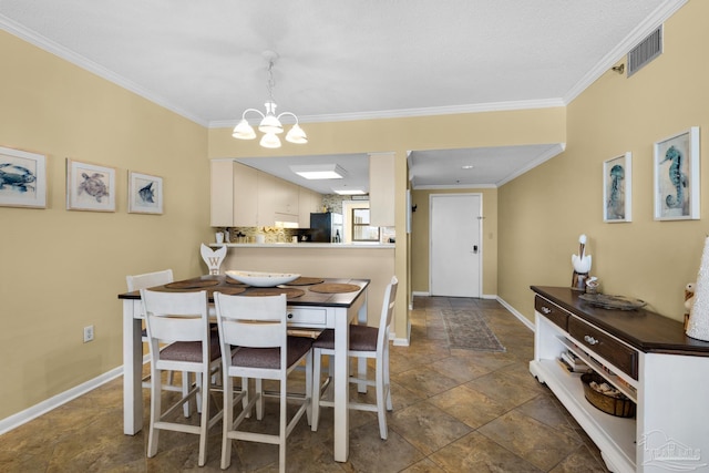 dining room featuring an inviting chandelier and ornamental molding