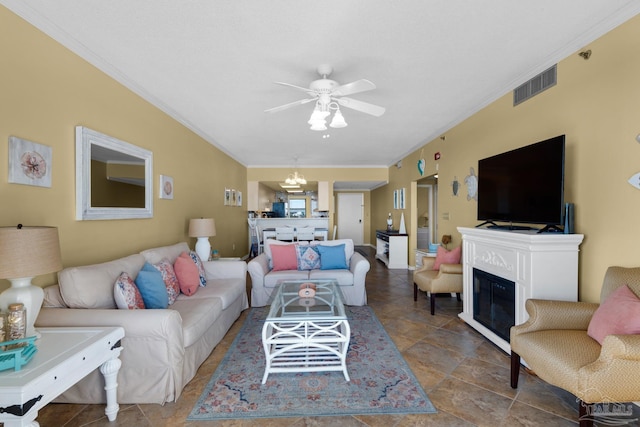 living room featuring ceiling fan with notable chandelier