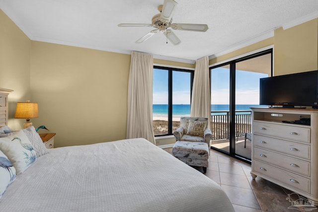 tiled bedroom with a textured ceiling, ceiling fan, access to exterior, and crown molding