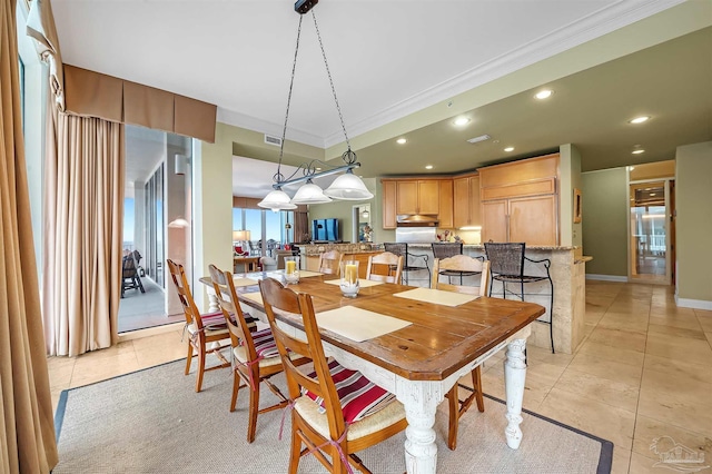 tiled dining space with crown molding