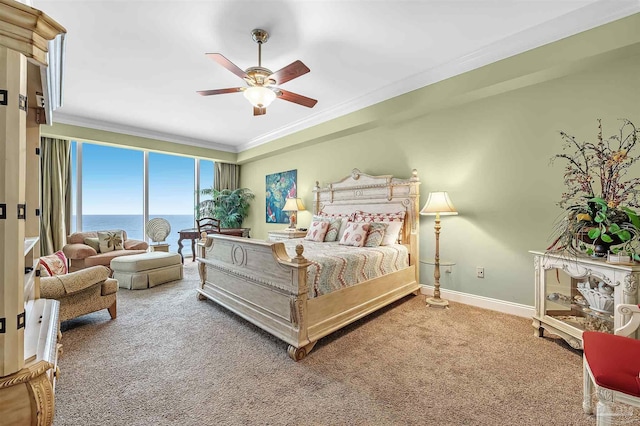 bedroom featuring a water view, ceiling fan, ornamental molding, and carpet floors
