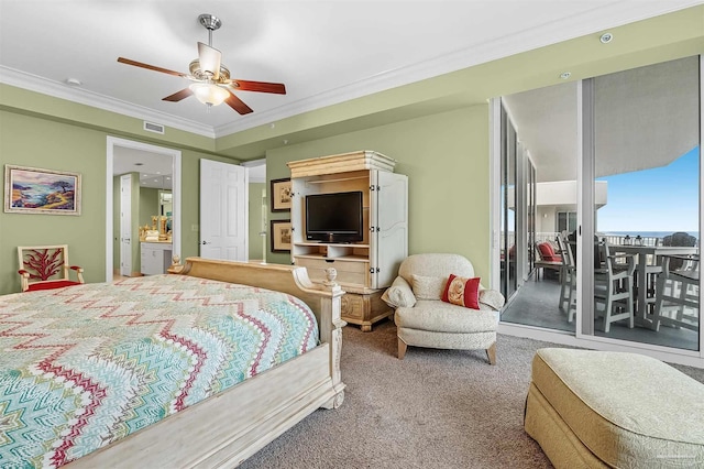 bedroom with ceiling fan, ornamental molding, and carpet flooring