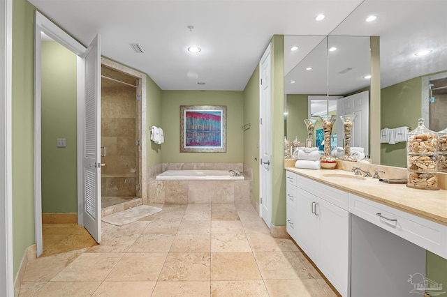 bathroom featuring vanity, separate shower and tub, and tile patterned floors
