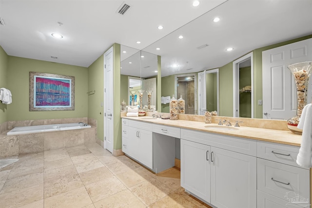 bathroom featuring independent shower and bath and vanity