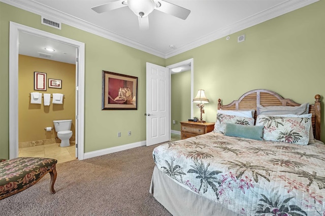 carpeted bedroom featuring connected bathroom, ornamental molding, and ceiling fan