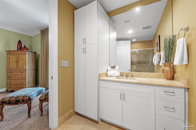 bathroom with tile patterned flooring, vanity, and a shower with shower door